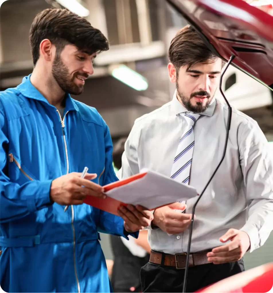two man looking at car engine - weR1 automotive