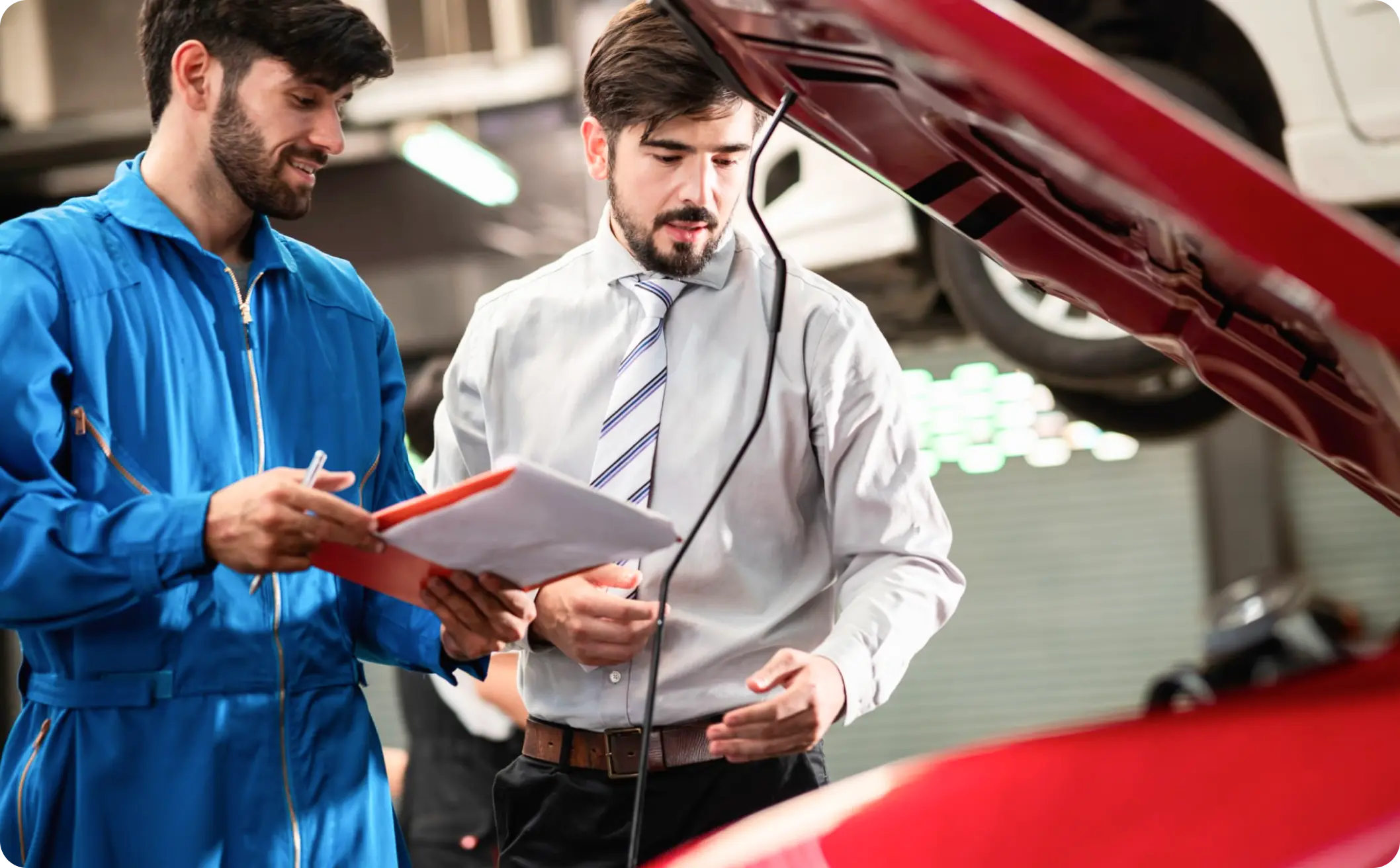 two man looking at car engine - weR1 automotive